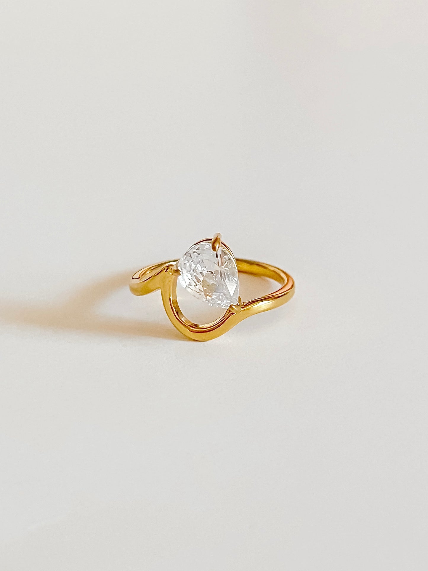 Pear solitaire ring