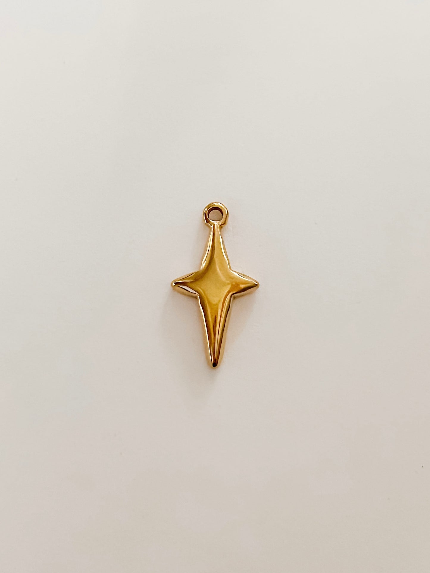 Four pointed star charm